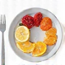 Icono de un plato de desayuno con frutas.